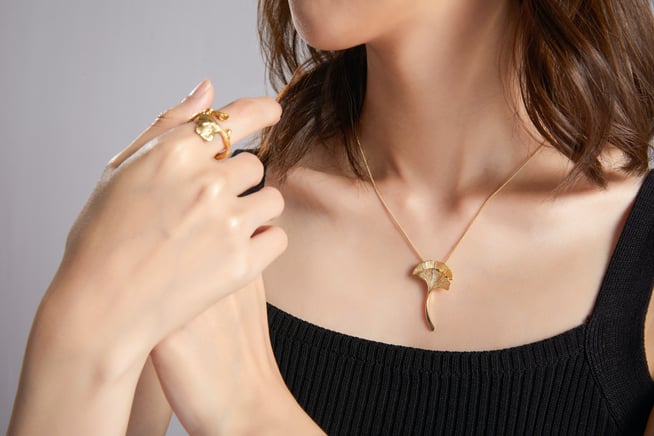 Delicate gold necklace and ring